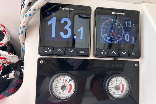 Slide: The Image of Sailing instruments on a 2004 Manta 42 MkII, displaying depth and speed readings. - 25