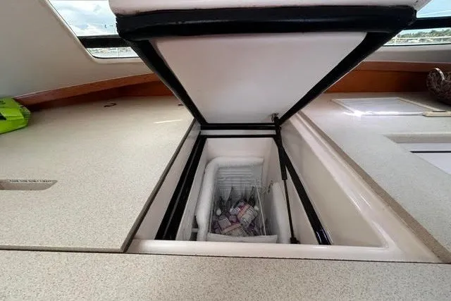 Slide: The Image of Built-in cooler on 2004 Manta 42 MkII yacht, open with beverages inside. - 13