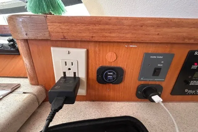 Slide: The Image of Electrical outlet and control panel on a 2004 Manta 42 MkII yacht interior. - 32