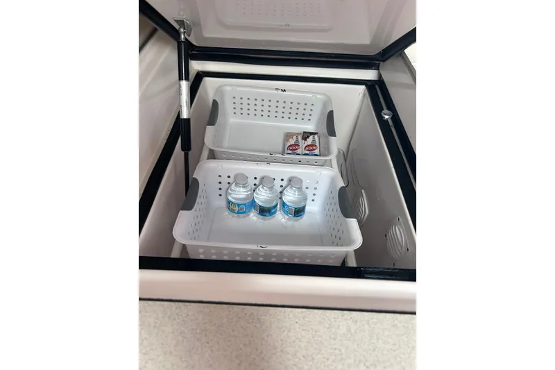 Slide: The Image of Open cooler with water bottles and snacks inside, Manta 42 MkII, 2004 model. - 15