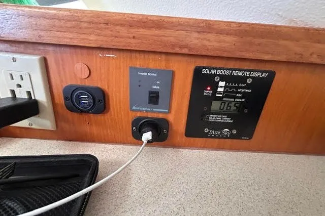 Slide: The Image of Control panel on 2004 Manta 42 MkII with solar boost display and USB charging ports. - 29