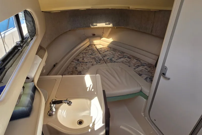 Slide: The Image of Interior cabin of 2003 Grady-White Sailfish 282 with sink and seating area. - 18