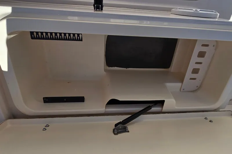 Slide: The Image of Storage compartment of a 2003 Grady-White Sailfish 282 boat, featuring organized interior space. - 32