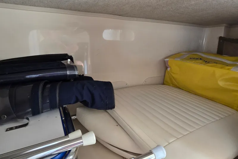 Slide: The Image of Interior storage of 2003 Grady-White Sailfish 282 with seat and equipment. - 22