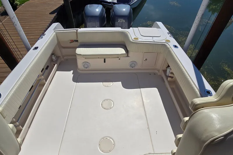 Slide: The Image of 2003 Grady-White Sailfish 282 boat deck with seating and twin engines. - 7