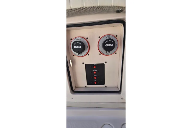 Slide: The Image of Control panel of a 2003 Grady-White Sailfish 282 boat with battery switches. - 31