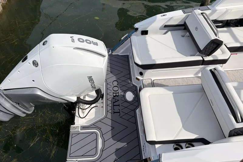 Slide: The Image of 2026 Cobalt R6 Outboard boat with Mercury 600 V8 engine, featuring sleek white seating. - 7