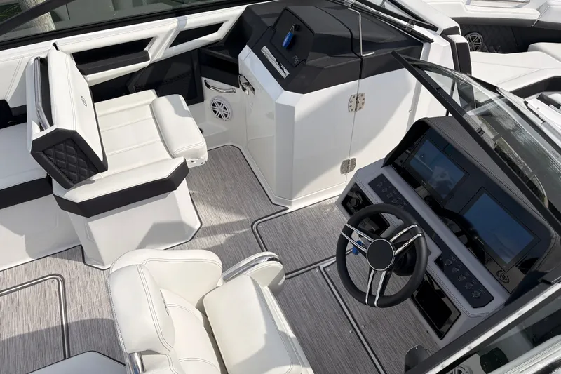 Slide: The Image of 2026 Cobalt R6 Outboard boat interior with modern dashboard and luxurious seating. - 8