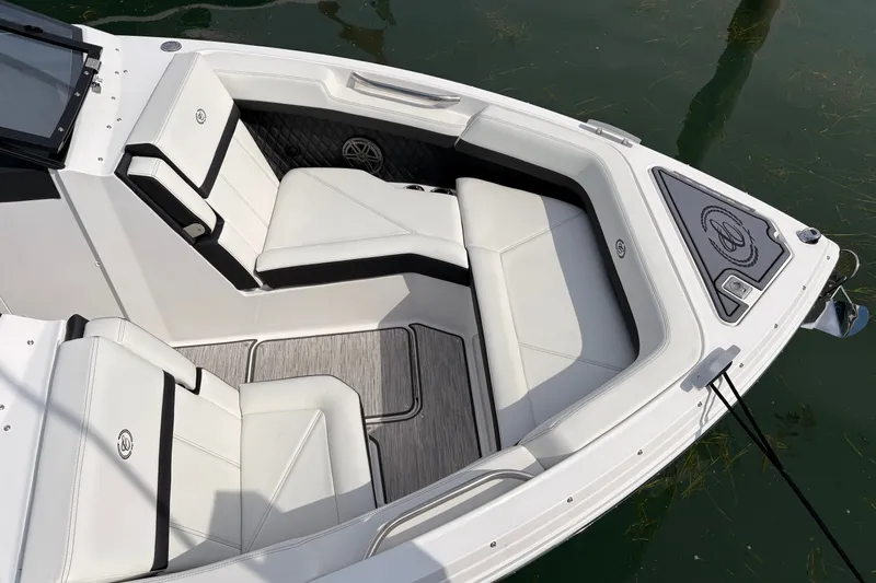 Slide: The Image of Luxurious seating area on 2026 Cobalt R6 Outboard boat, featuring sleek white upholstery. - 9