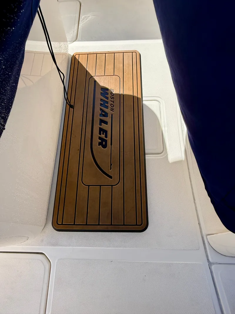 Slide: The Image of Wood-look flooring with Boston Whaler logo on a boat. - 18