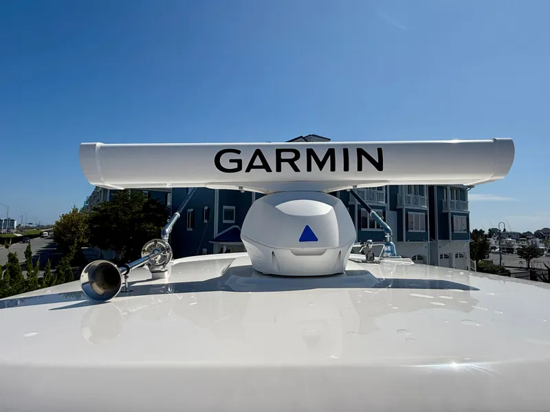 Slide: The Image of The image shows a Garmin radar on a 2024 Boston Whaler 250 Outrage. - 45