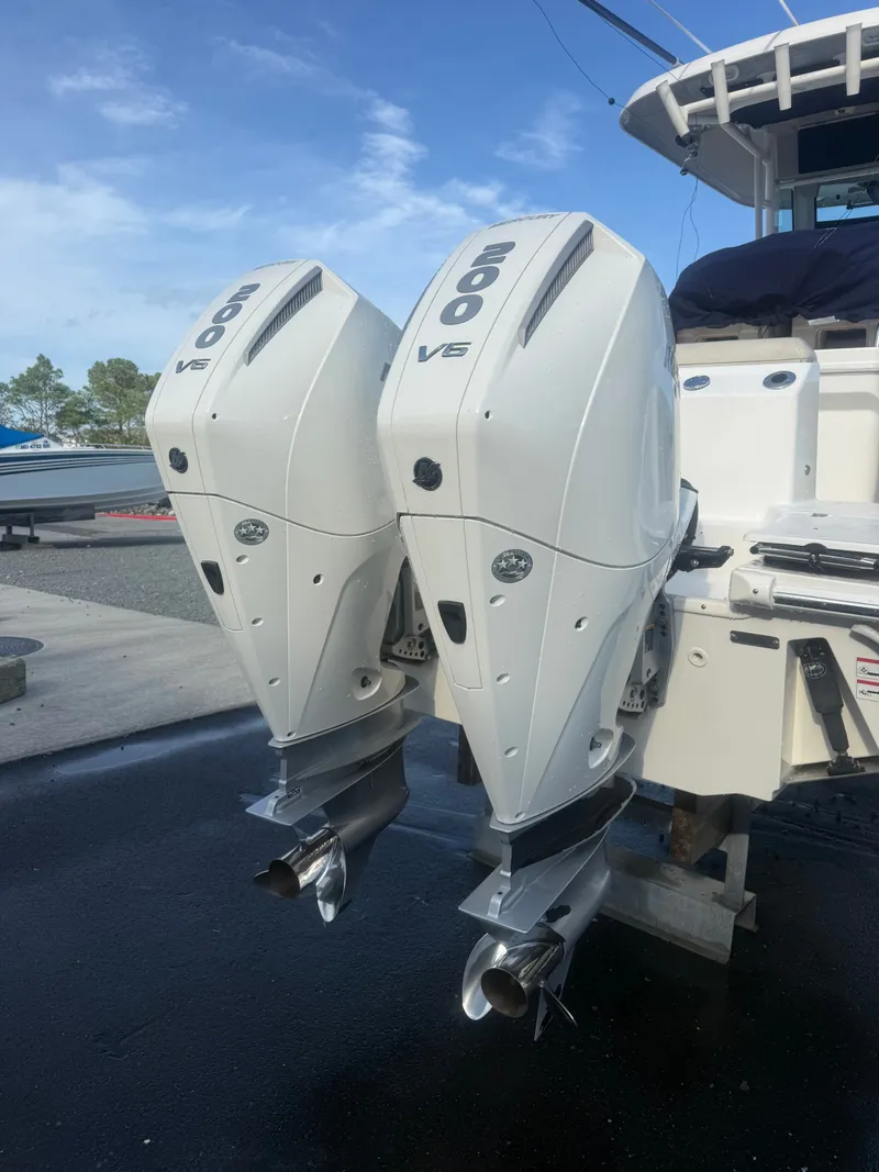Slide: The Image of Two powerful outboard engines on a 2024 Boston Whaler 250 Outrage. - 40