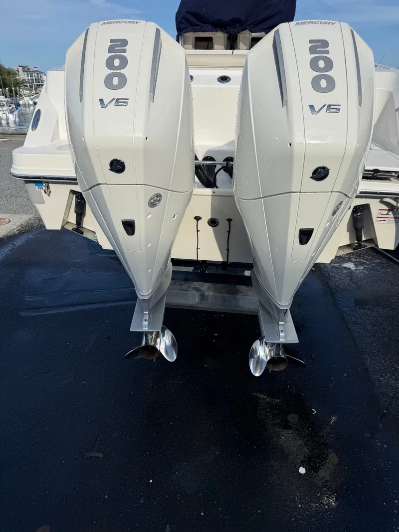 Slide: The Image of Two Mercury V6 outboard engines on a Boston Whaler 250 Outrage boat. - 39