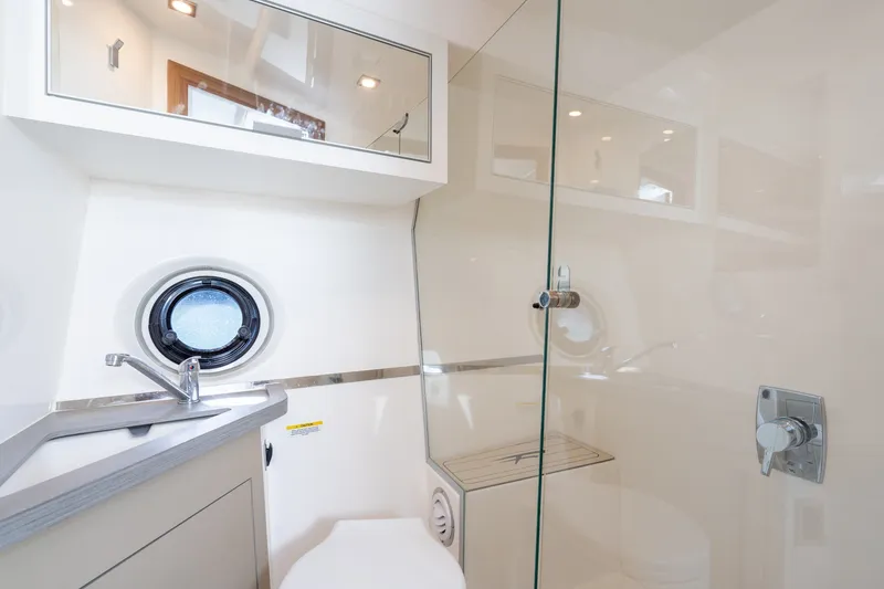 Slide: The Image of Modern bathroom interior in 2026 Granfort 370 GTX yacht, featuring sleek fixtures and glass shower. - 34