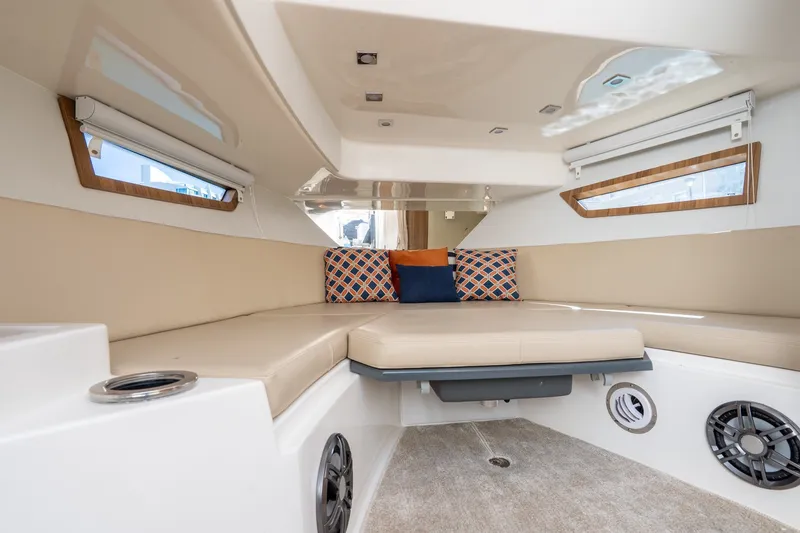 Slide: The Image of Luxurious interior of 2026 Granfort 370 GTX yacht with beige seating and decorative pillows. - 23