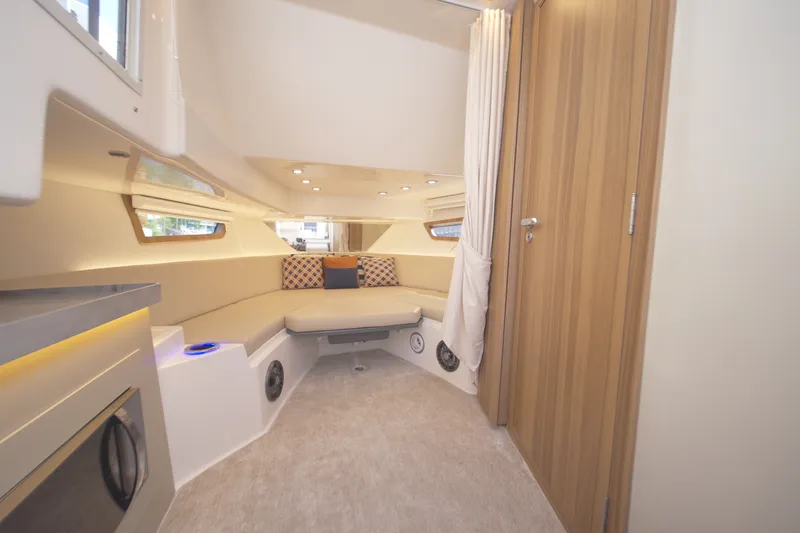 Slide: The Image of Luxurious interior of 2026 Granfort 370 GTX yacht with modern seating and wood accents. - 24