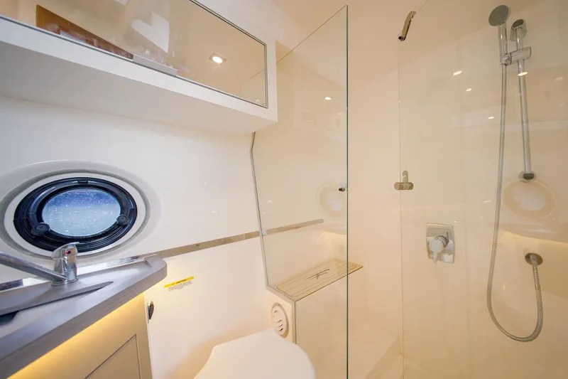 Slide: The Image of Luxurious bathroom in 2026 Granfort 370 GTX yacht with modern shower and porthole window. - 33