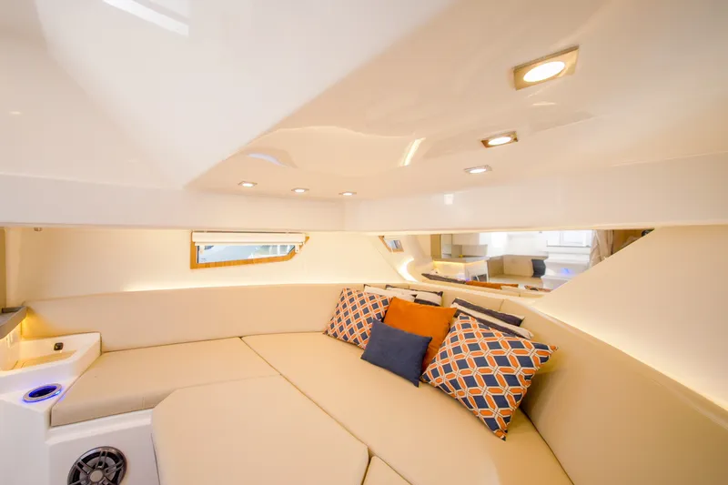 Slide: The Image of Luxurious interior of 2026 Granfort 370 GTX yacht with plush seating and decorative cushions. - 29