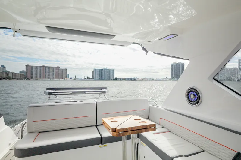 Slide: The Image of Luxurious interior of 2026 Granfort 370 GTX yacht with waterfront city view. - 22