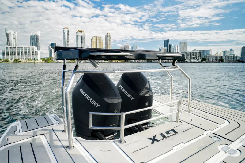 Slide: The Image of Granfort 370 GTX 2026 boat with dual Mercury engines, city skyline in background. - 15