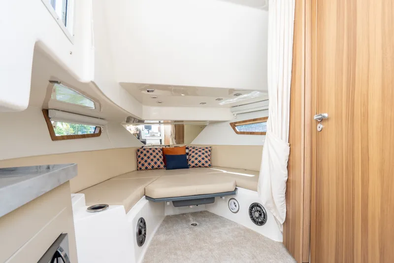 Slide: The Image of Interior of 2026 Granfort 370 GTX yacht with cozy seating and modern design. - 25