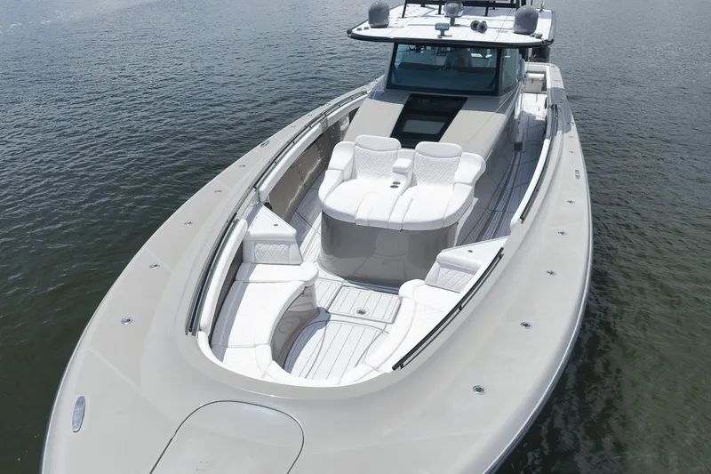 Slide: The Image of 2023 HCB 65 Estrella luxury yacht with spacious deck and elegant seating on water. - 18