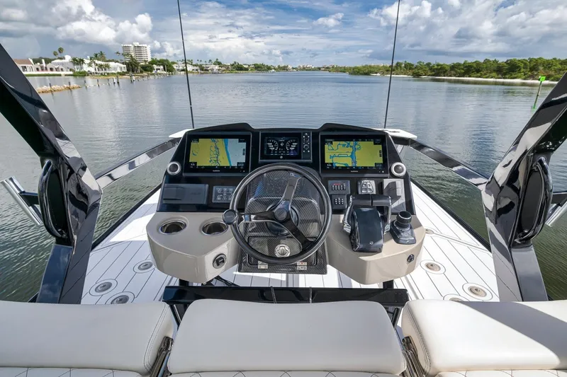 Slide: The Image of Helm of 2023 HCB 65 Estrella yacht with navigation screens and controls. - 37