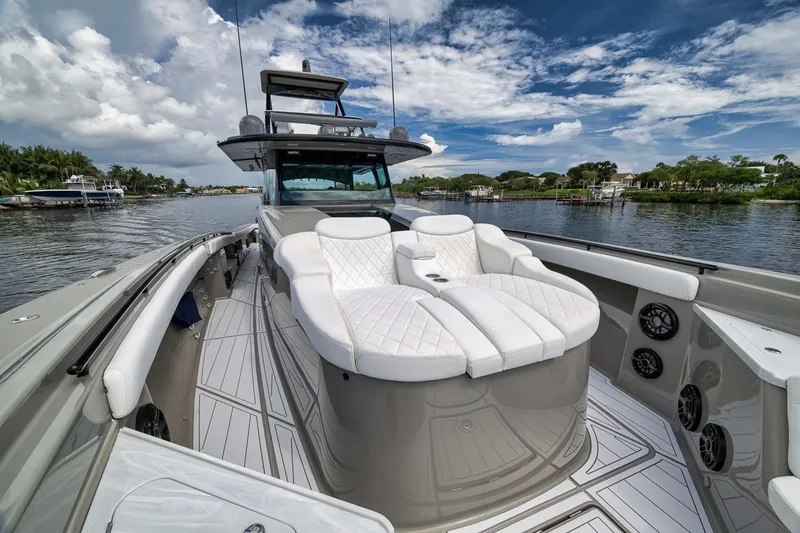 Slide: The Image of Luxurious 2023 HCB 65 Estrella yacht with plush seating on a scenic waterway. - 51