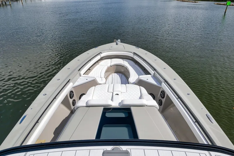 Slide: The Image of 2023 HCB 65 Estrella luxury boat with spacious seating on calm water. - 42
