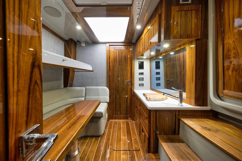 Slide: The Image of Luxurious interior of 2023 HCB 65 Estrella yacht with elegant wood finishes and modern amenities. - 31