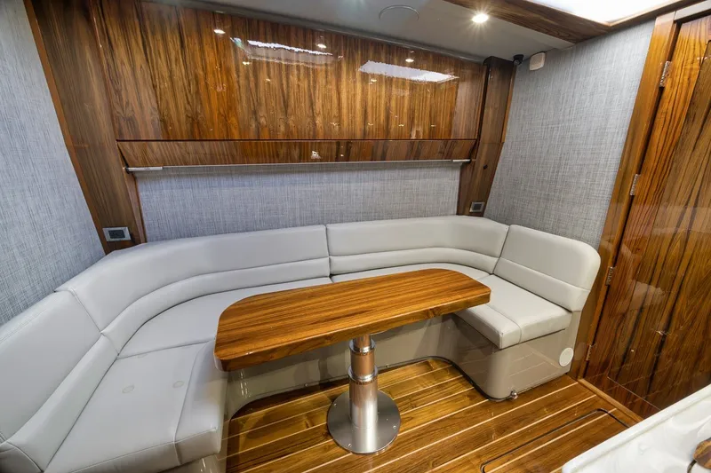 Slide: The Image of Luxurious interior of 2023 HCB 65 Estrella yacht with elegant wood and leather seating. - 28