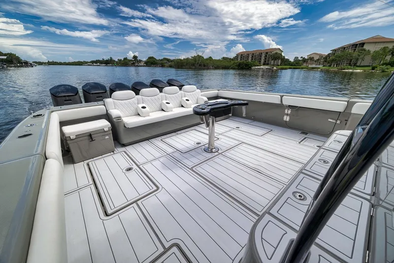 Slide: The Image of Luxurious 2023 HCB 65 Estrella boat interior with spacious seating and scenic water view. - 54