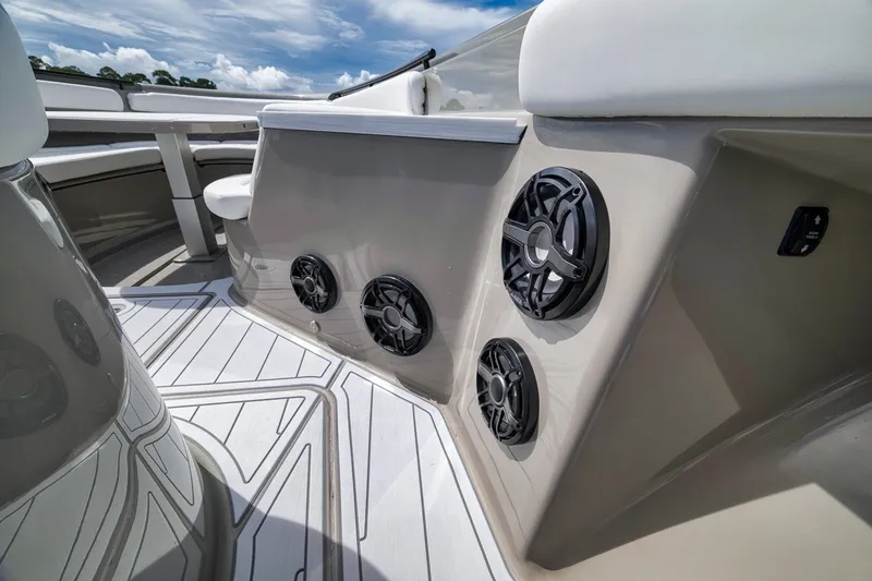 Slide: The Image of 2023 HCB 65 Estrella boat interior with sleek speakers and modern design. - 45