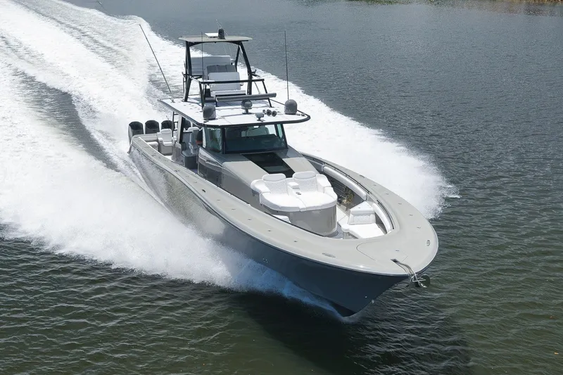 Slide: The Image of 2023 HCB 65 Estrella luxury boat cruising swiftly on open water. - 3