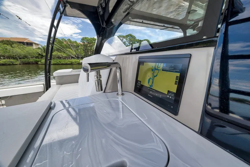 Slide: The Image of 2023 HCB 65 Estrella yacht interior with sleek sink and navigation display. - 59