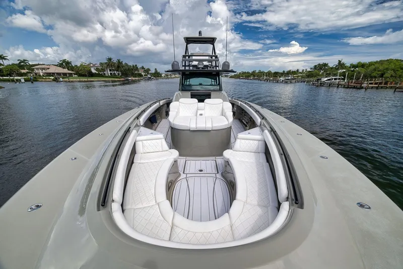 Slide: The Image of 2023 HCB 65 Estrella luxury yacht with spacious seating on a scenic waterway. - 48