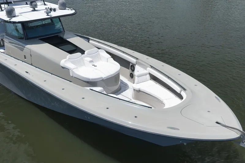 Slide: The Image of 2023 HCB 65 Estrella luxury yacht with sleek design and spacious deck on water. - 16