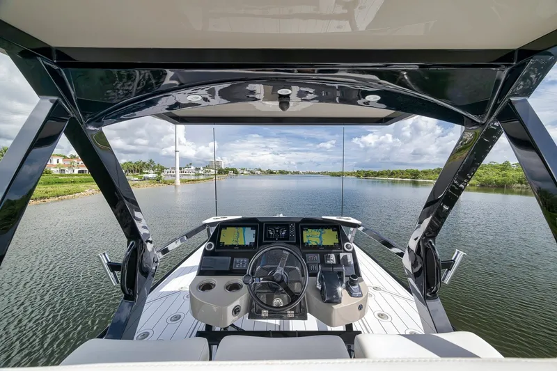 Slide: The Image of Cockpit view of 2023 HCB 65 Estrella yacht navigating a serene waterway. - 35