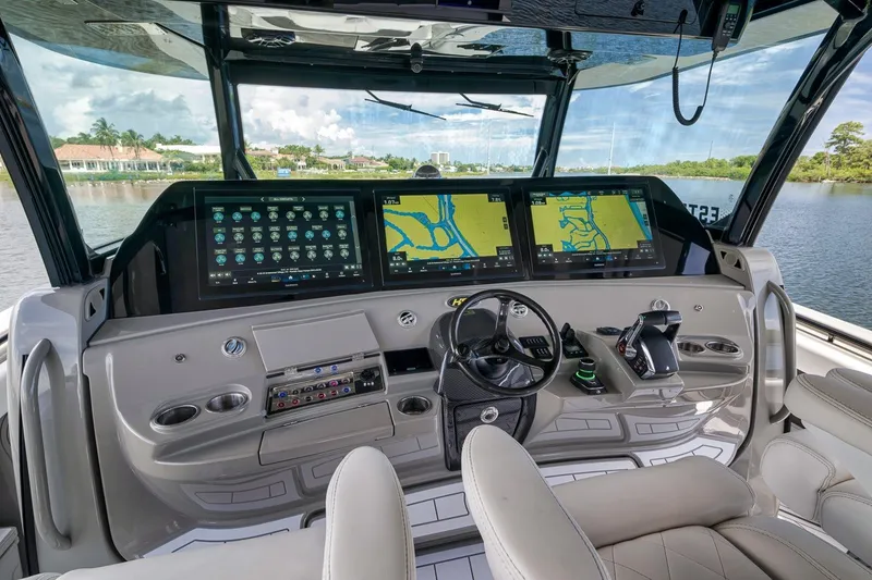 Slide: The Image of Helm of 2023 HCB 65 Estrella yacht with advanced navigation displays and controls. - 72