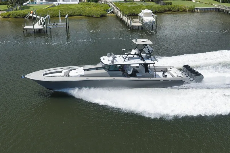 Slide: The Image of 2023 HCB 65 Estrella luxury yacht cruising on a serene waterway. - 6
