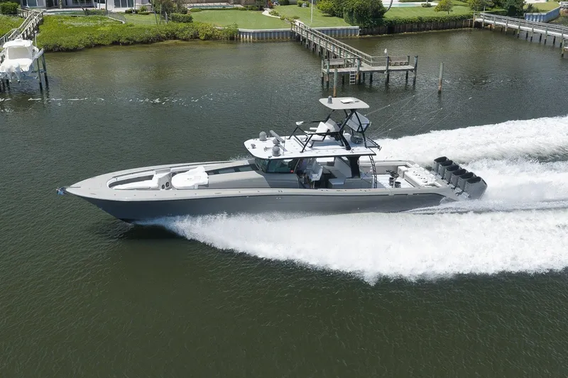 Slide: The Image of 2023 HCB 65 Estrella luxury yacht cruising on a serene waterway. - 5