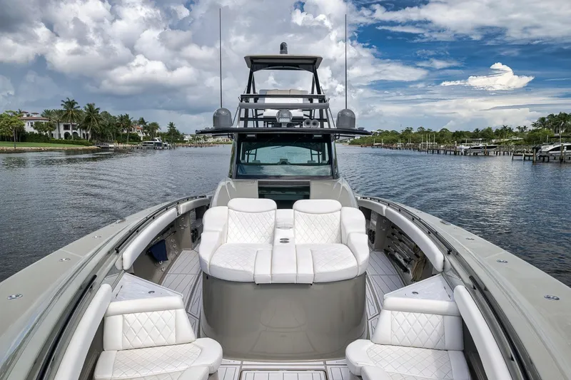 Slide: The Image of Luxurious 2023 HCB 65 Estrella yacht with plush seating, cruising on a scenic waterway. - 49