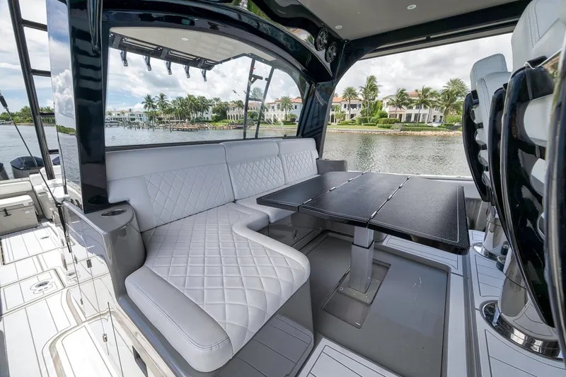 Slide: The Image of Luxurious seating area on 2023 HCB 65 Estrella yacht, featuring elegant design and waterfront view. - 69