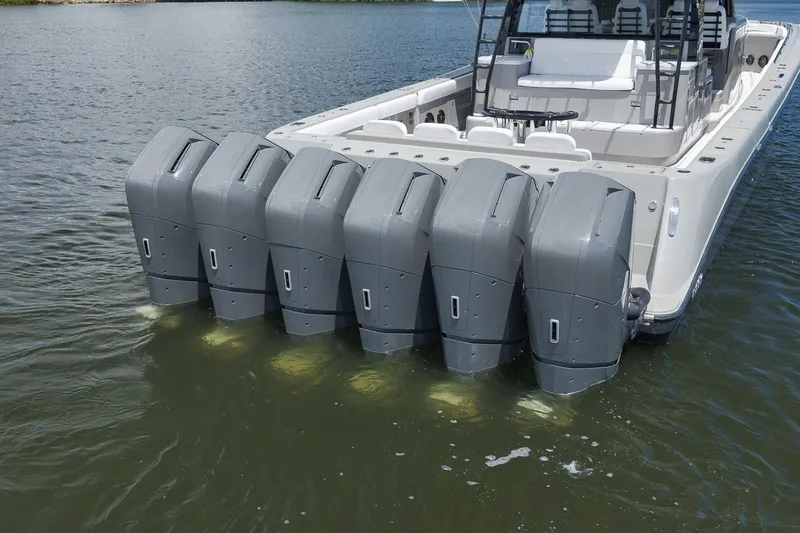 Slide: The Image of 2023 HCB 65 Estrella boat with seven powerful outboard engines on water. - 24