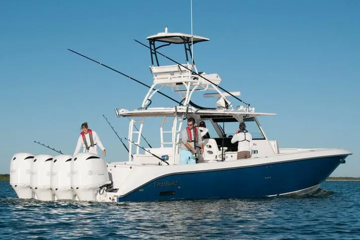 Slide: The Image of Manufacturer Provided Image: 2016 Everglades 435 Center Console boat with multiple outboard engines on water. - 28