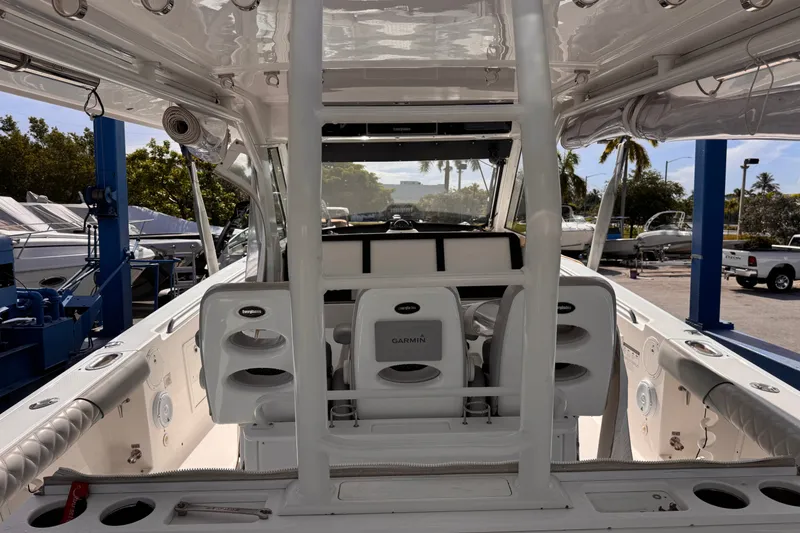 Slide: The Image of 2016 Everglades 435 Center Console boat interior with seating and equipment. - 16