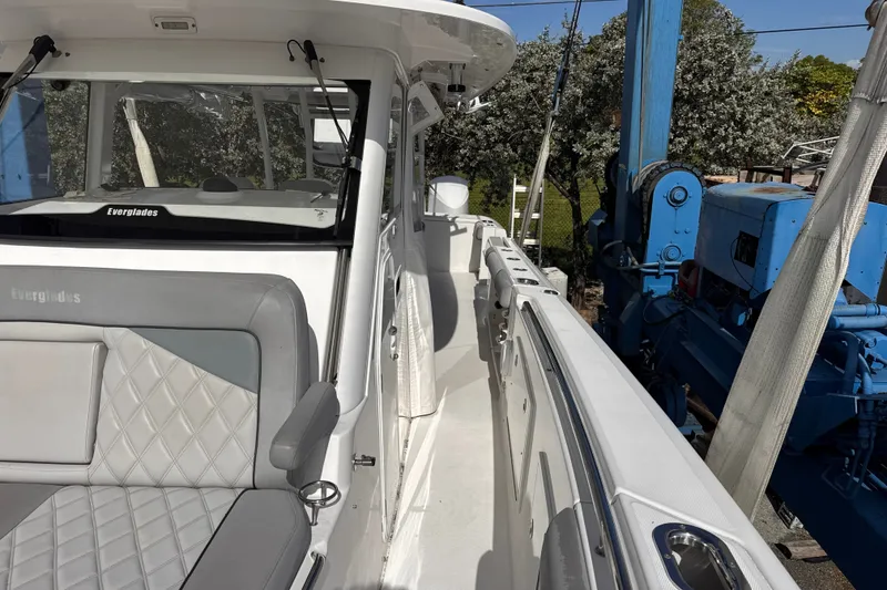Slide: The Image of 2016 Everglades 435 Center Console boat with sleek seating and modern design. - 6