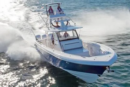 Slide: The Image of Manufacturer Provided Image: 2016 Everglades 435 Center Console boat cruising on open water. - 27