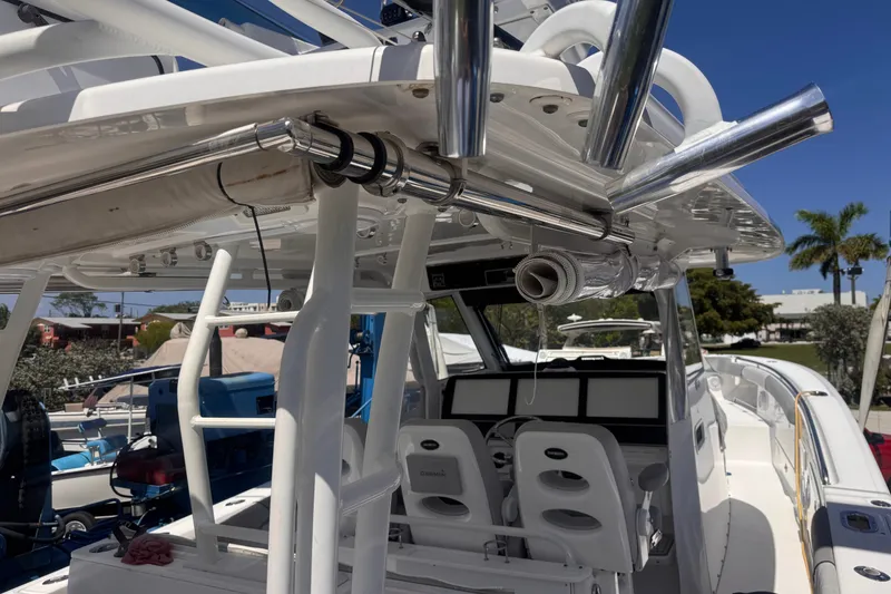 Slide: The Image of 2016 Everglades 435 Center Console boat interior with seating and control panels. - 25