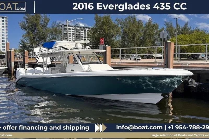 Slide: The Image of 2016 Everglades 435 Center Console boat docked, showcasing sleek design and modern features. - 0